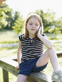 Girl talking on cell phone outdoors