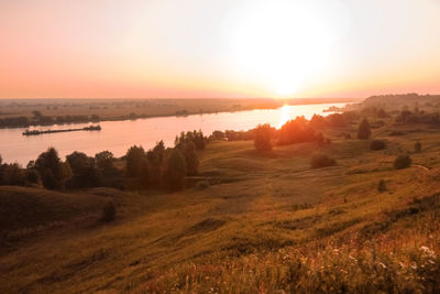 Scenic view of landscape against sky during sunset