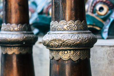 Close-up of religious bowls in temple