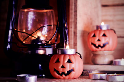 Close-up of lit candles on table