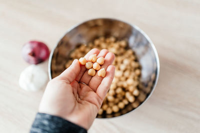 Close-up of hand holding bowl