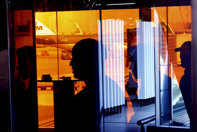 Reflection of people on window