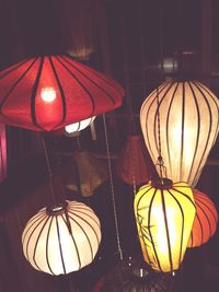 Low angle view of illuminated lanterns hanging on ceiling