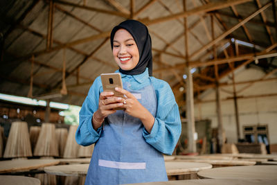 Young woman using mobile phone