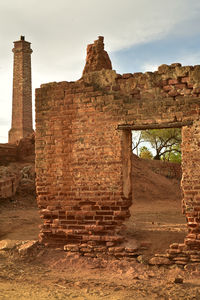 Old ruins of building against sky