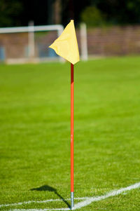 Yellow umbrella on field