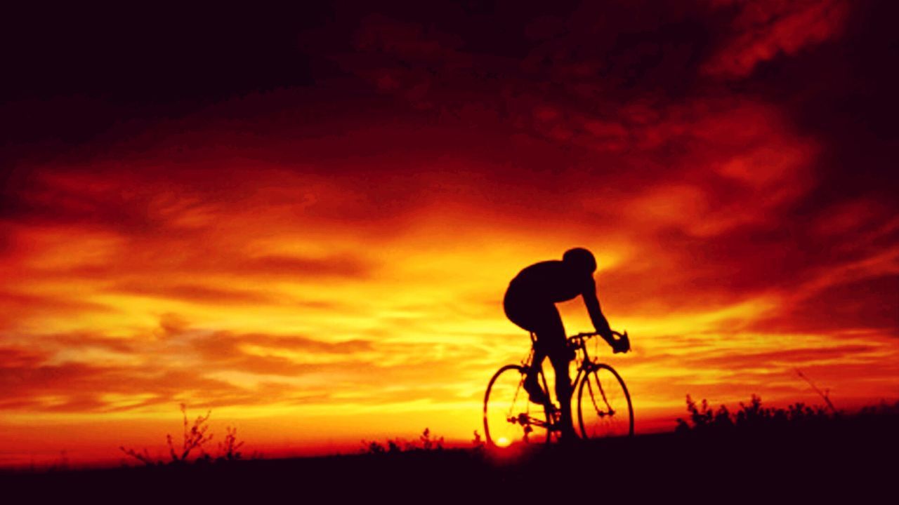 transportation, bicycle, silhouette, sunset, mode of transport, land vehicle, cycling, riding, dramatic sky, orange color, stationary, dark, sky, outdoors, tranquil scene, cycle, moody sky, scenics, romantic sky