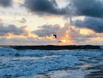 Scenic view of sea against sky during sunset