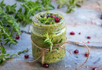 Close-up of fruits in glass jar on table