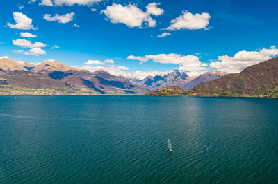 View of lake como, looking north, from musso, with alps, villages and the mountains of valtellina.