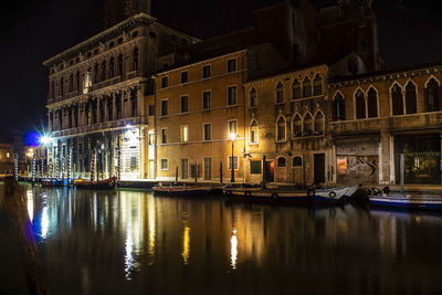 Reflection of buildings in city at night