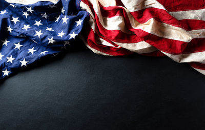 High angle view of flags against blue wall