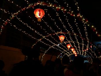 Low angle view of illuminated christmas tree at night