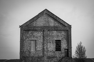 Low angle view of old building against sky