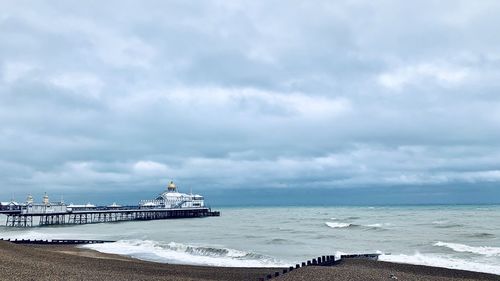 Scenic view of sea against cloudy sky