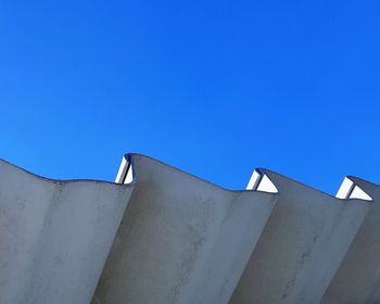 Low angle view of building against blue sky