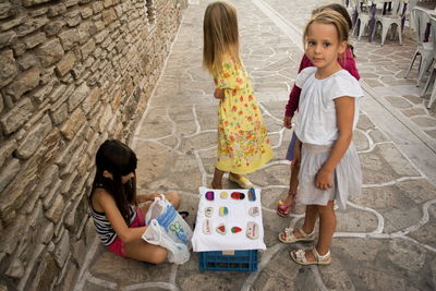 High angle view of girls sitting on floor