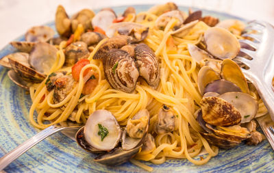 Close-up of noodles served with seafood in plate