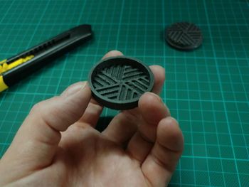 Close-up of hand holding paper