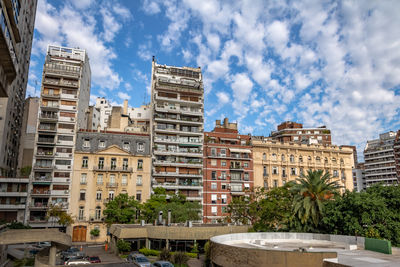 Buildings in city against sky