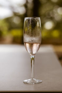 Close-up of wineglass on table