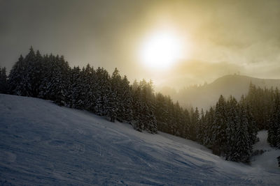 Scenic view of snow covered landscape against sky