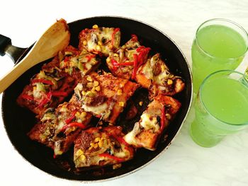 High angle view of meat in frying pan