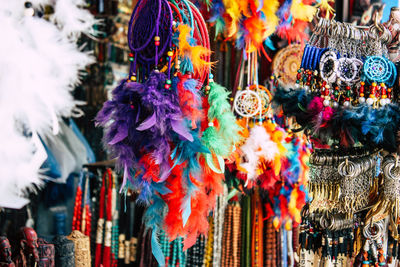 Close-up of multi colored decorations hanging at market stall