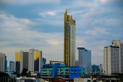 Modern buildings in city against sky