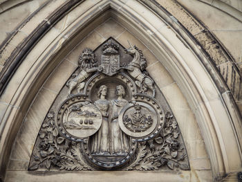 Low angle view of ornate sculpture on building
