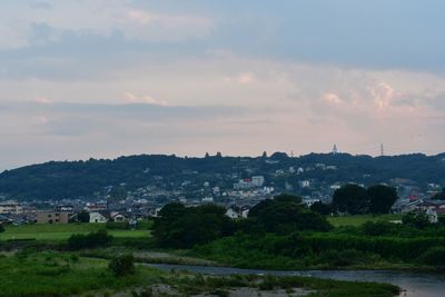 Scenic view of townscape against sky