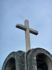 Low angle view of cross against clear sky