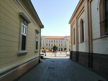 Street amidst buildings against sky