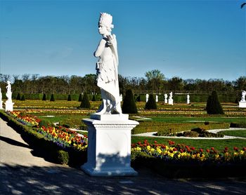 Statue in park against clear sky