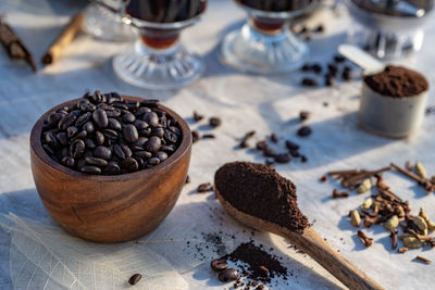 Still life with coffee beans, wooden spoon making coffee at home