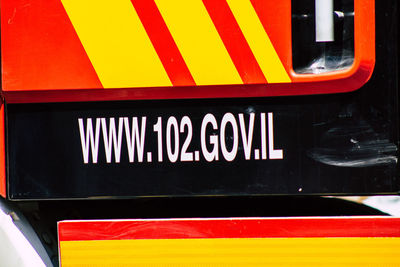 Close-up of yellow text on car
