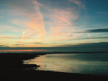 Scenic view of sea against sky at sunset