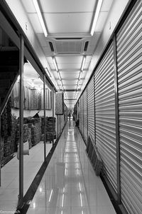 Empty road leading towards building