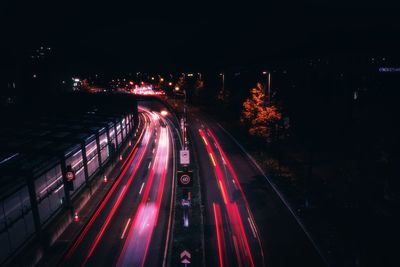 High angle view of light trails on road at night