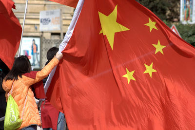 Woman holding chinese flag