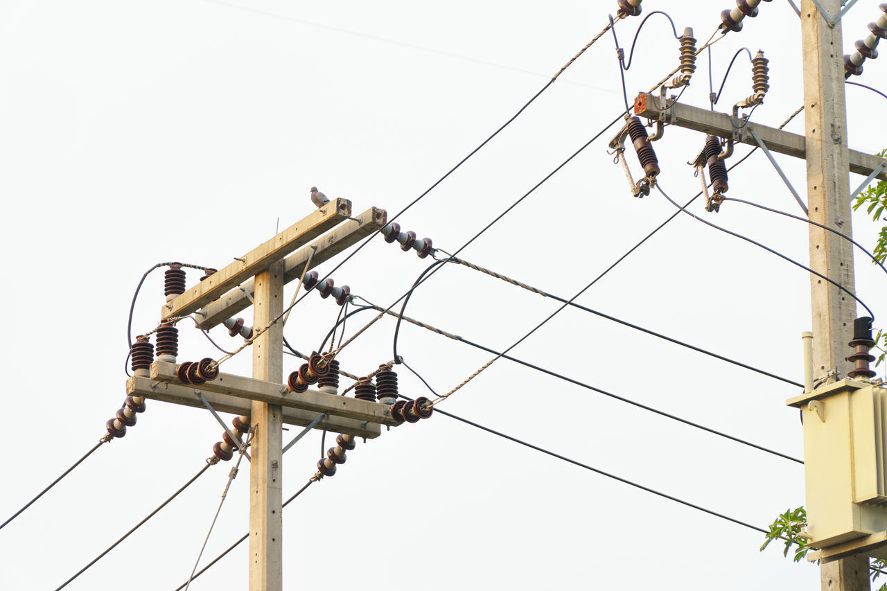 LOW ANGLE VIEW OF ELECTRICITY PYLONS AGAINST SKY