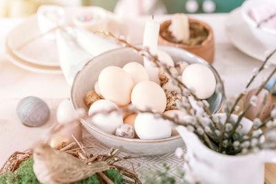 Happy easter and spring holidays time. festive tablescape set decor. traditional easter dinner food 