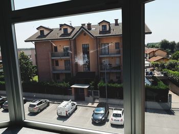 Cars on street by buildings in city