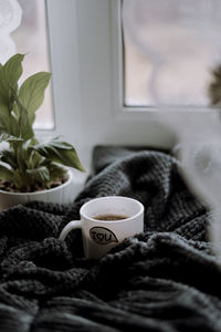 Close-up of coffee cup on table