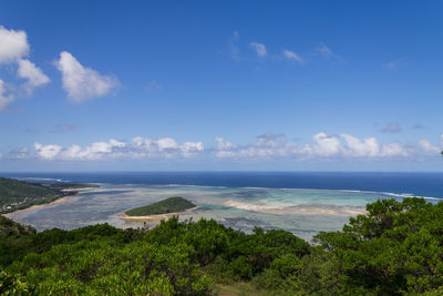 Scenic view of sea against blue sky