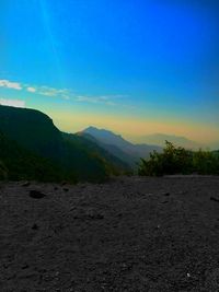 Scenic view of mountains against sky at sunset