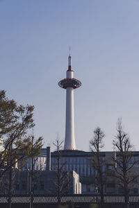 Low angle view of communications tower against sky