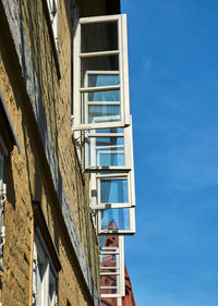 Low angle view of building against blue sky