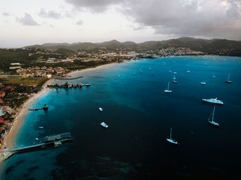 High angle view of boats in sea against sky