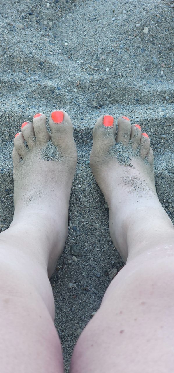 human leg, toe, limb, human foot, low section, one person, hand, finger, adult, nail polish, nail, lifestyles, women, barefoot, relaxation, close-up, leisure activity, high angle view, human limb, day, toenail, nature, blue, skin, outdoors